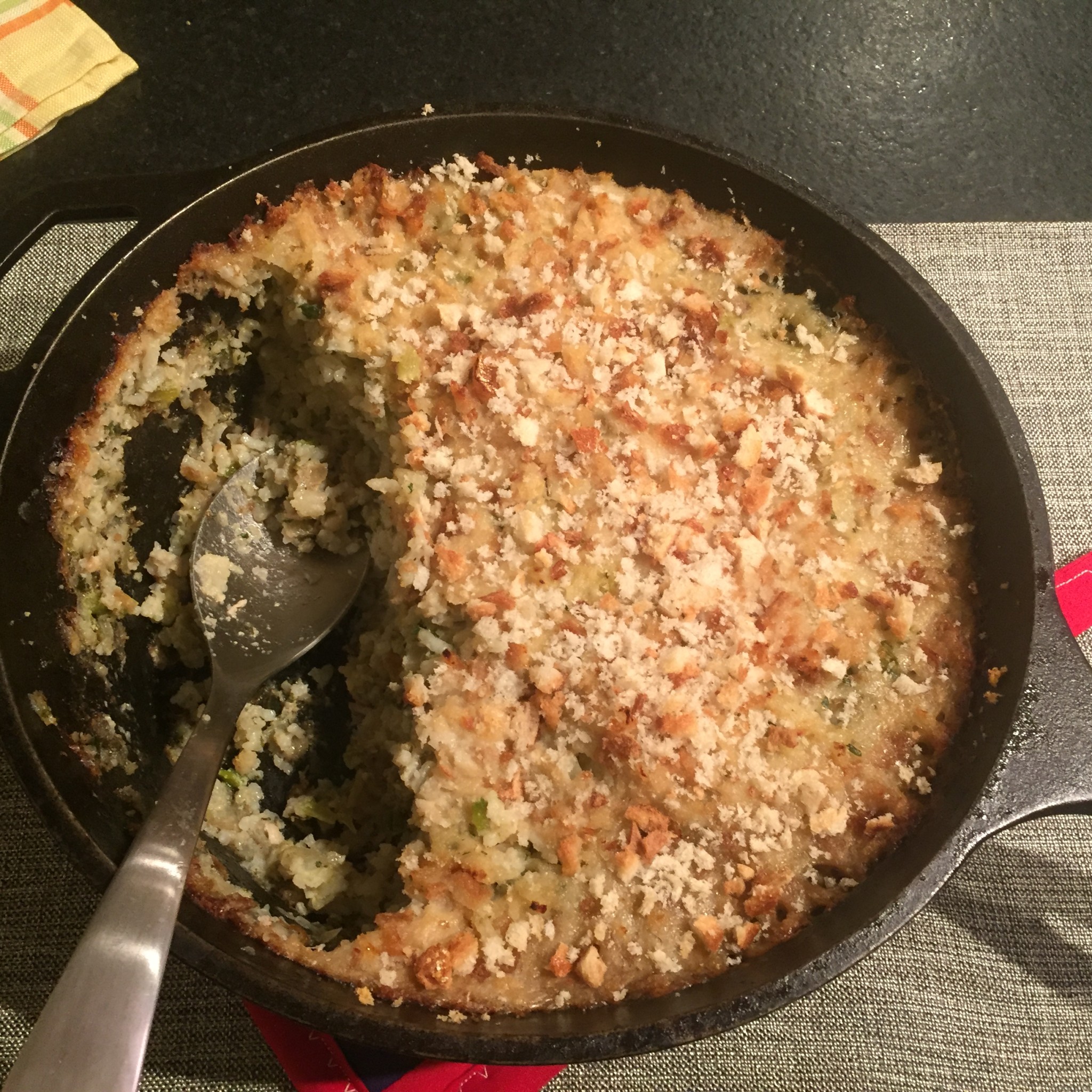 Deep skillet of oyster and rice dressing.