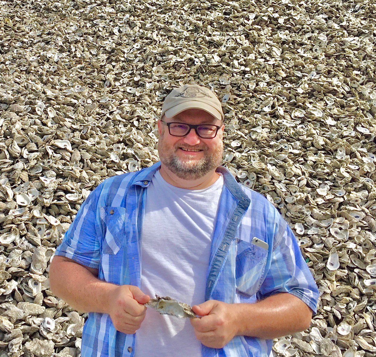 Jason Burnett in oyster shell pile